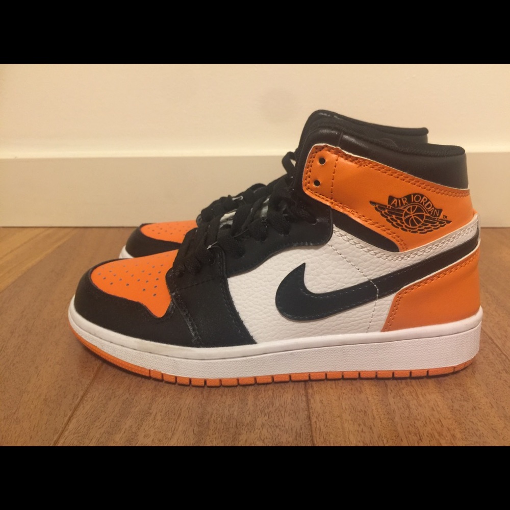 Jordan Athletic Shoes in Black, White, and Orange